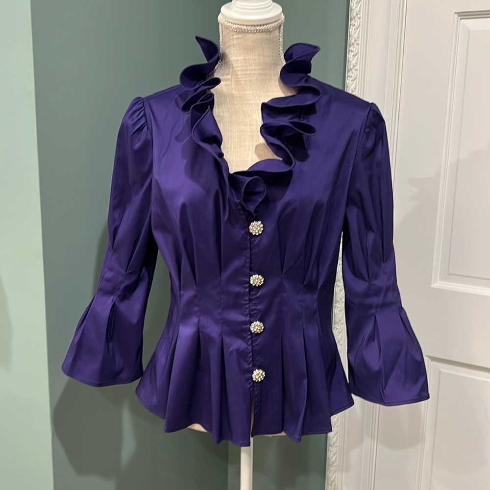 Joseph Ribkoff purple pleated top, ruffled neck w/ rhinestone buttons. Size 14